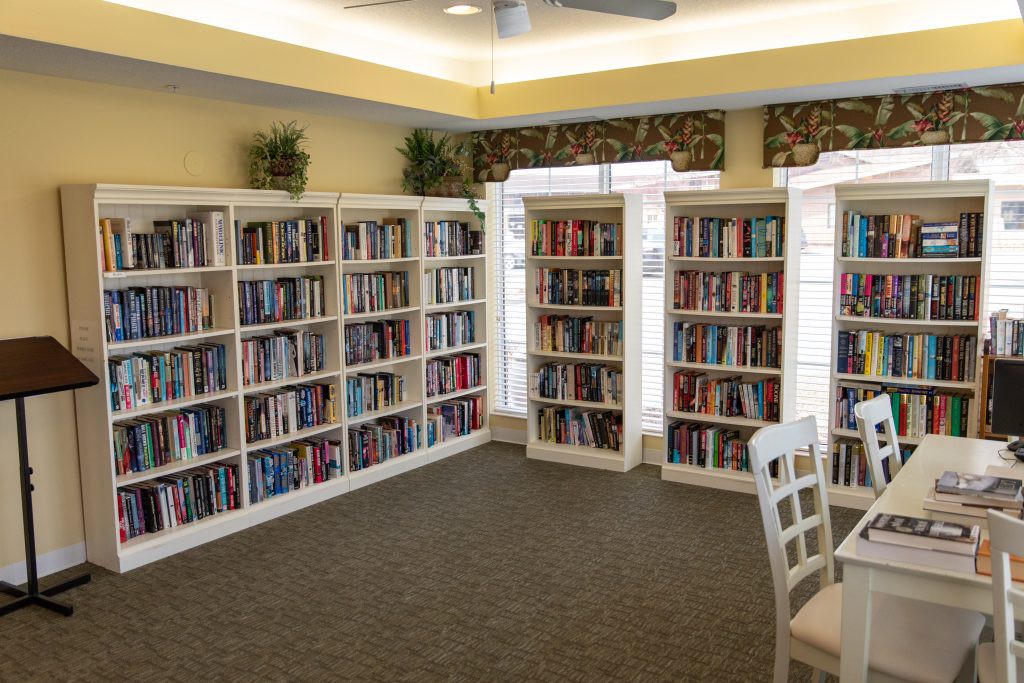 A cozy library corner with bookshelves filled with books.