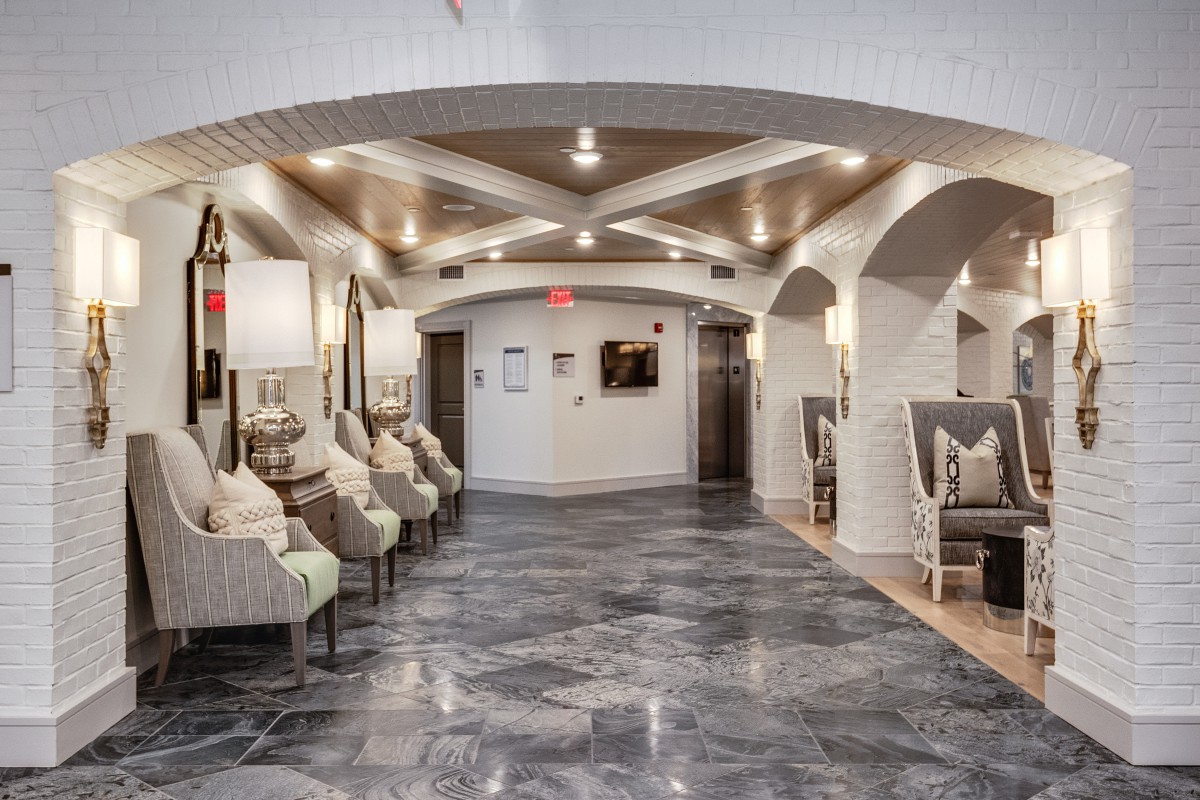 A modern lobby with elegant seating and sophisticated lighting.