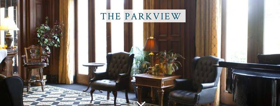 A cozy interior setting featuring classic furniture and warm lighting in The Parkview.