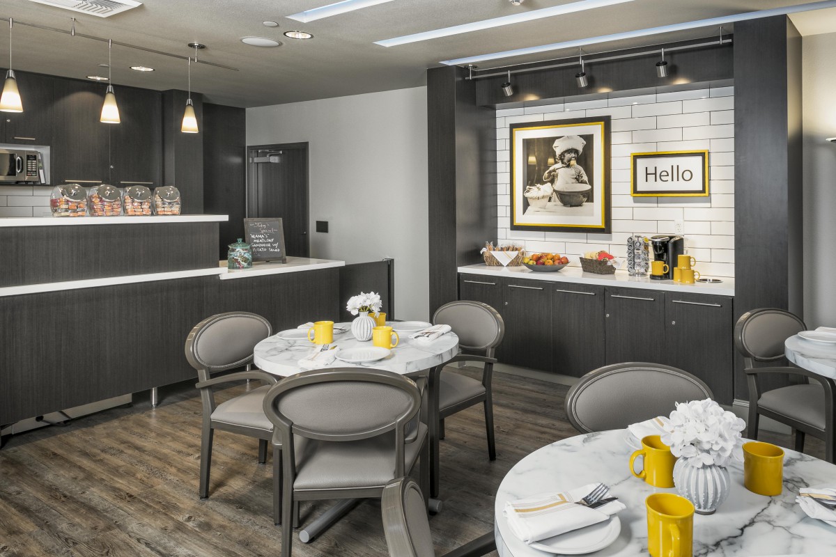 A modern cafe interior with neatly arranged tables and bright, inviting decor.