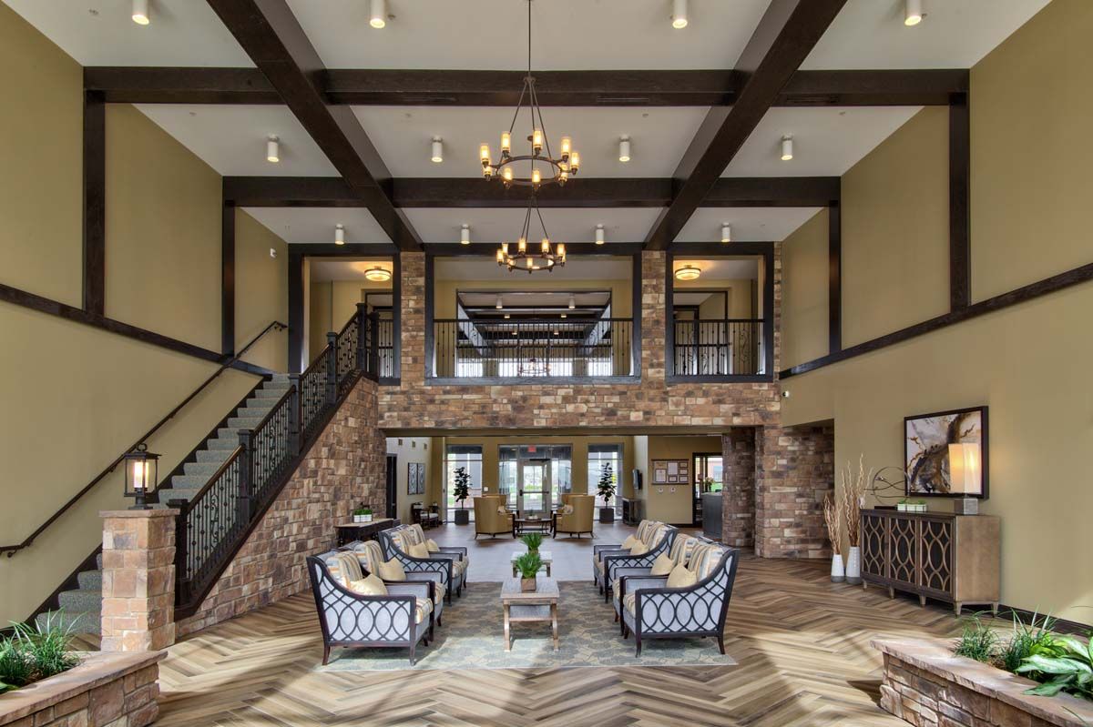 A luxurious and elegantly designed lobby with high ceilings, plush seating, and sophisticated lighting.