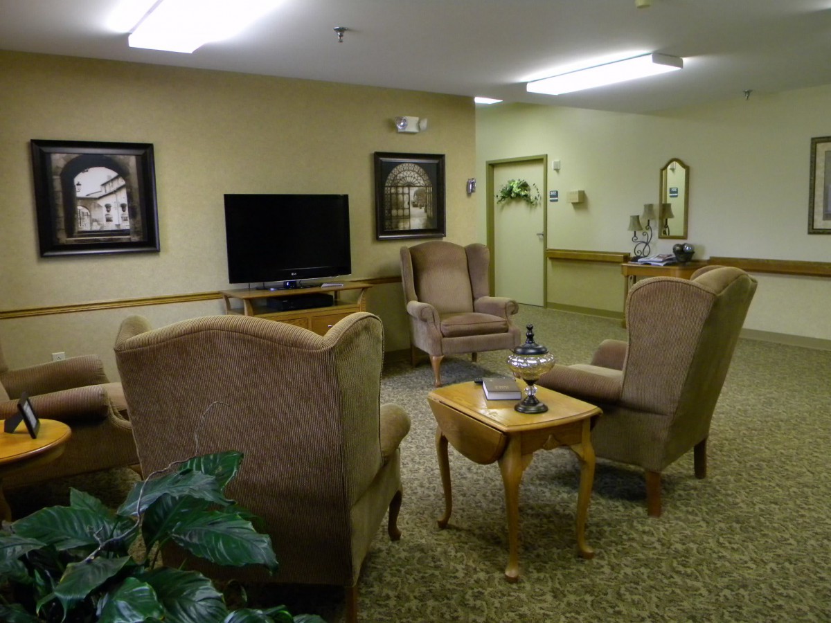 A cozy living room with comfortable seating and a television.