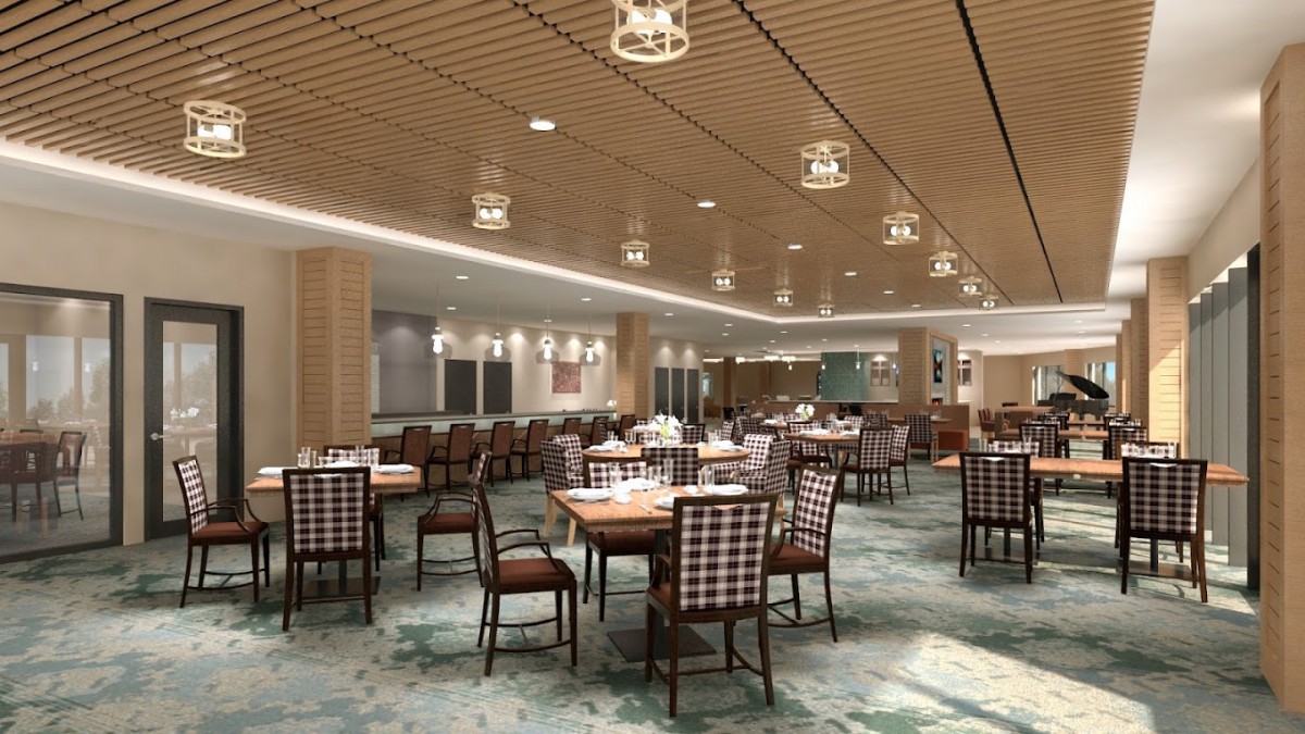 A modern restaurant dining area with neatly arranged tables and contemporary lighting.