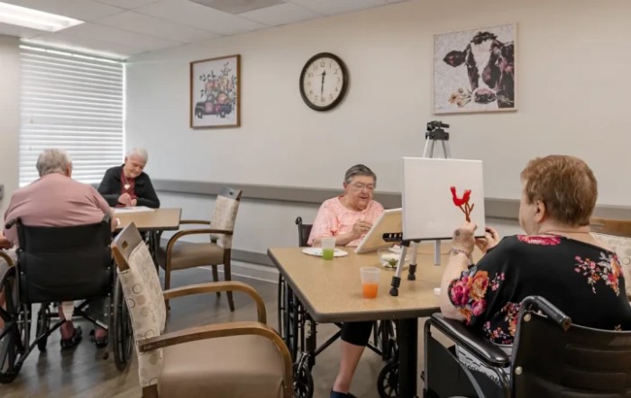 Seniors participating in an art class at a nursing home.