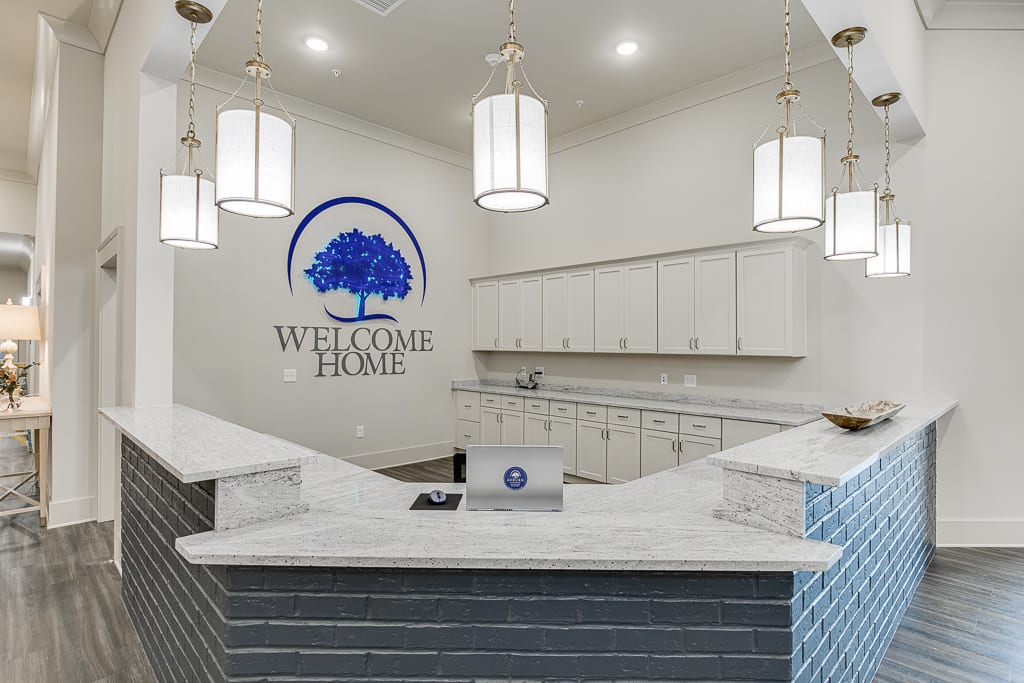 A modern reception area with a welcoming desk and elegant lighting.