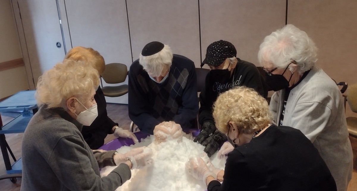 A group of people engaged in an indoor activity together.