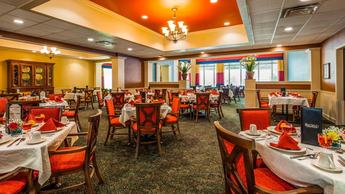 A well-decorated restaurant dining area with neatly arranged tables and chairs.