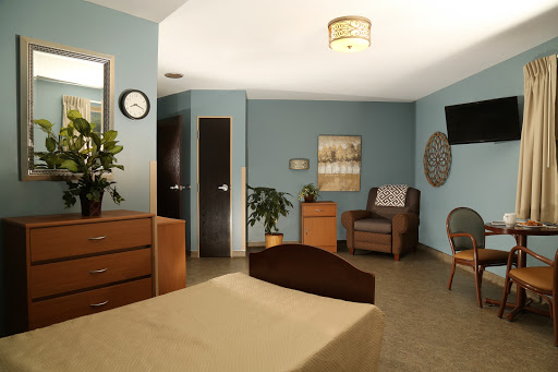 A cozy and modern bedroom showcasing minimalistic design with comfortable furnishings.