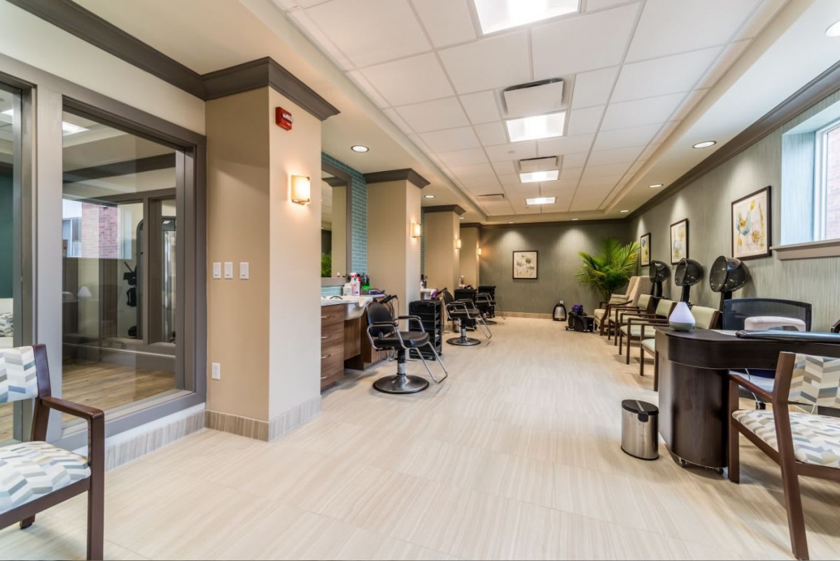 A modern hair salon interior with styling chairs and mirrors.