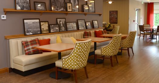 A cozy cafe interior with stylish seating and decorative elements.