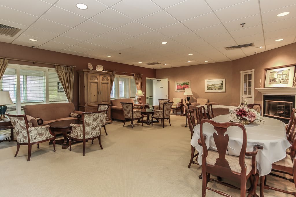 A cozy living room with traditional decor and comfortable seating arrangements.