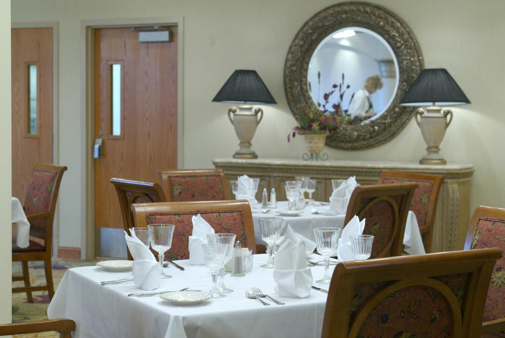 Elegant restaurant interior with neatly arranged tables and decorative elements.