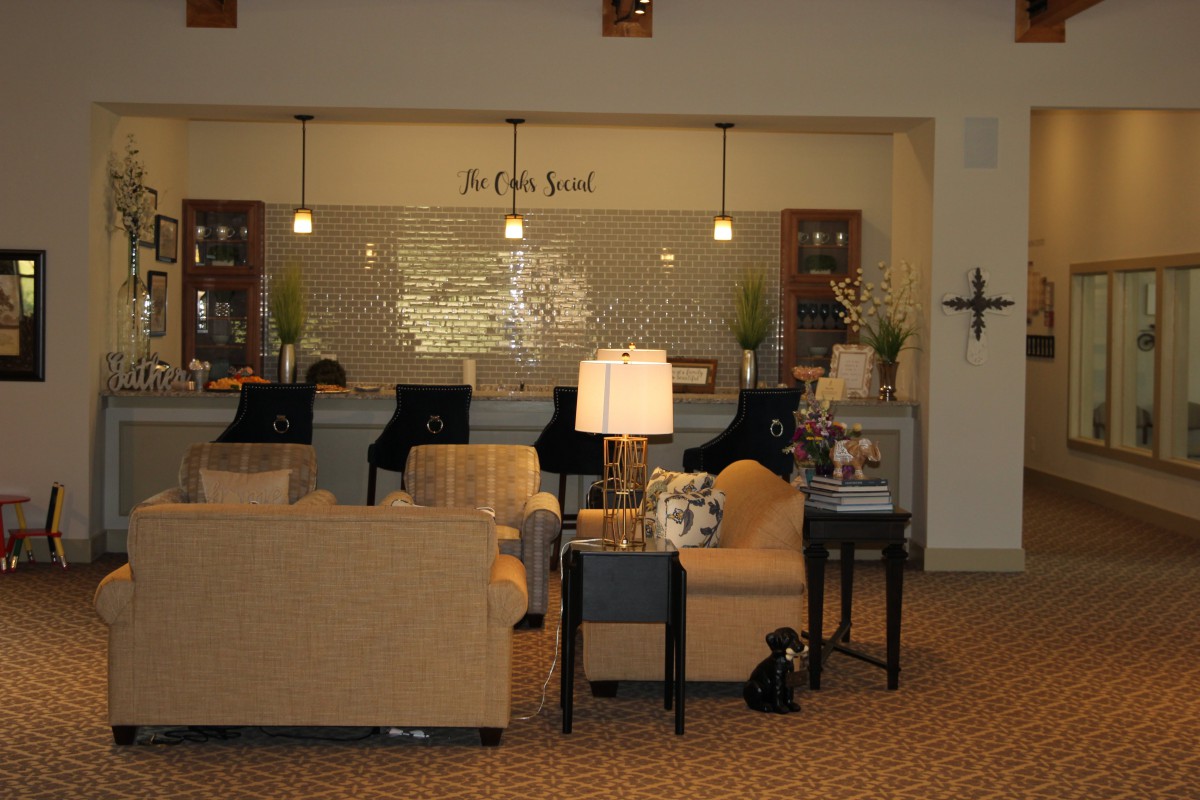 Cozy hotel lobby with seating area and reception desk.