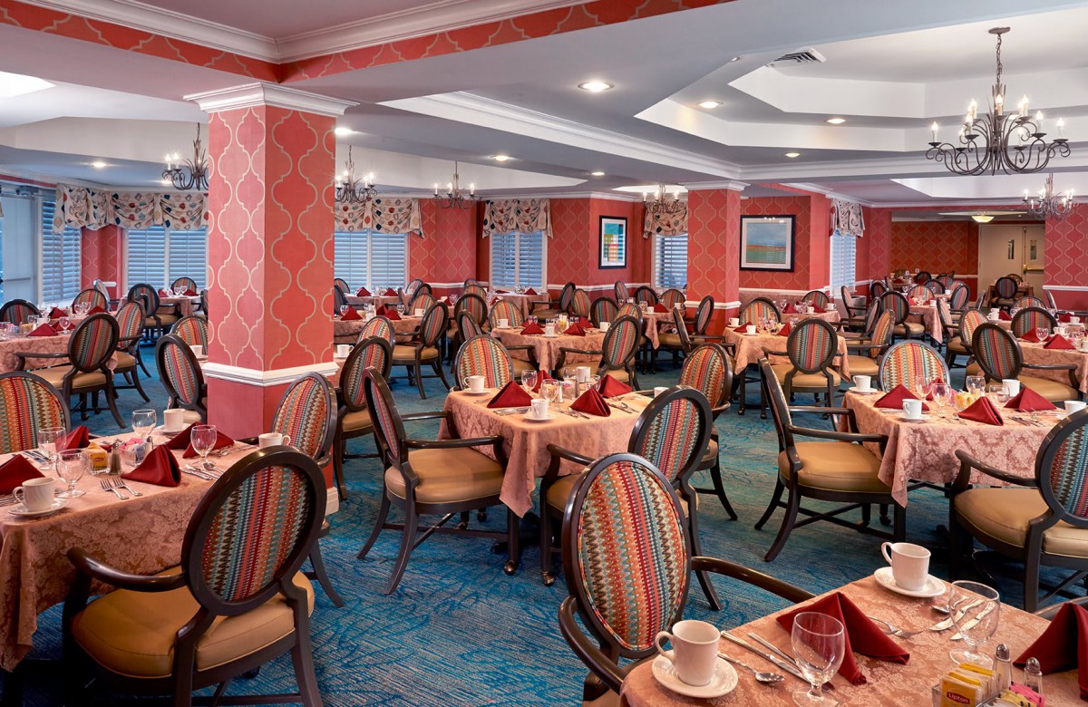 Elegant restaurant dining area with neatly arranged tables and chairs.