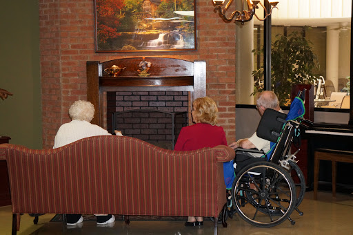 A warm gathering of seniors in a cozy living room setting.