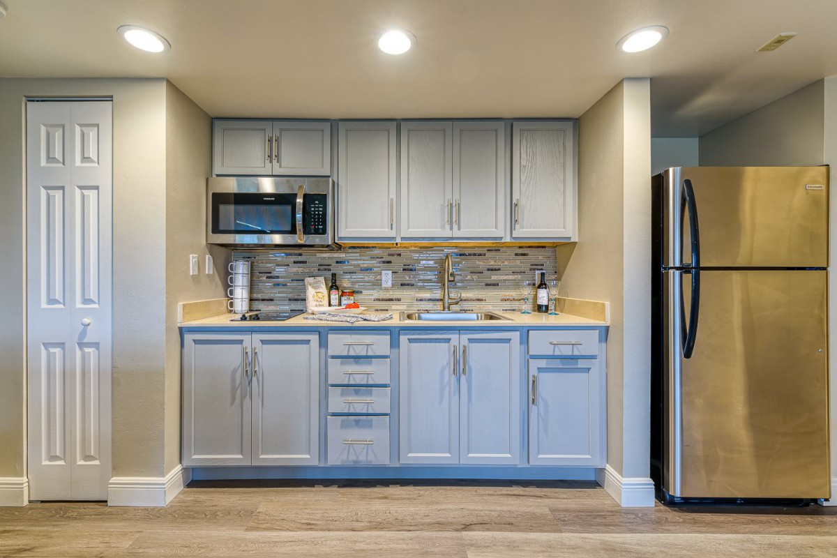 A modern kitchen with stainless steel appliances and sleek cabinetry.