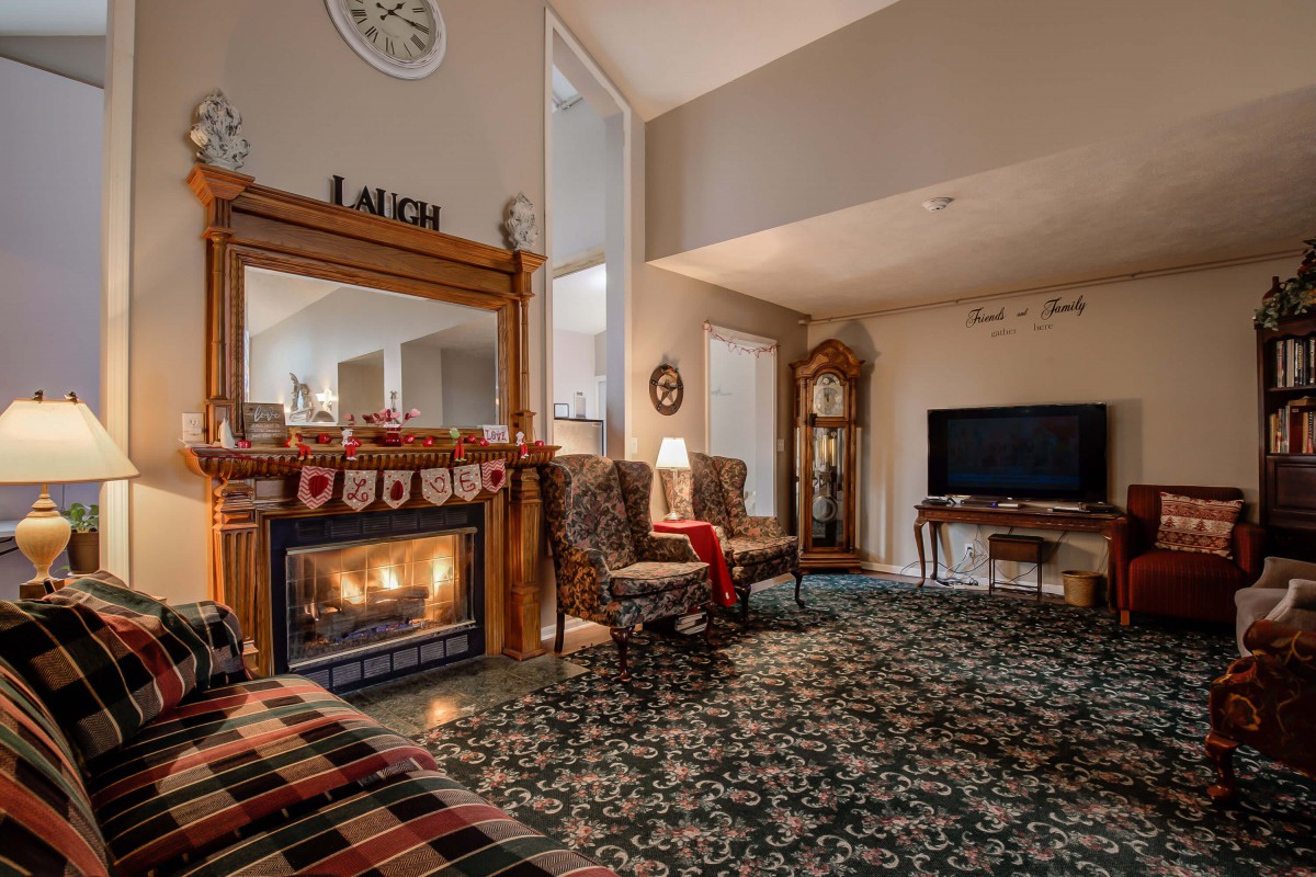 Cozy living room with a fireplace and traditional decor.