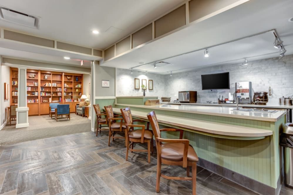 A cozy lounge area with a bar counter and comfortable seating.