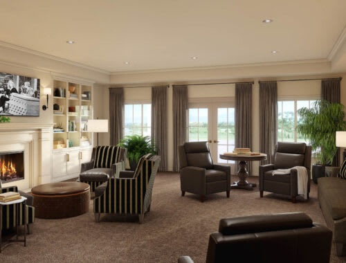 A spacious and elegantly designed living room with comfortable seating and large windows.