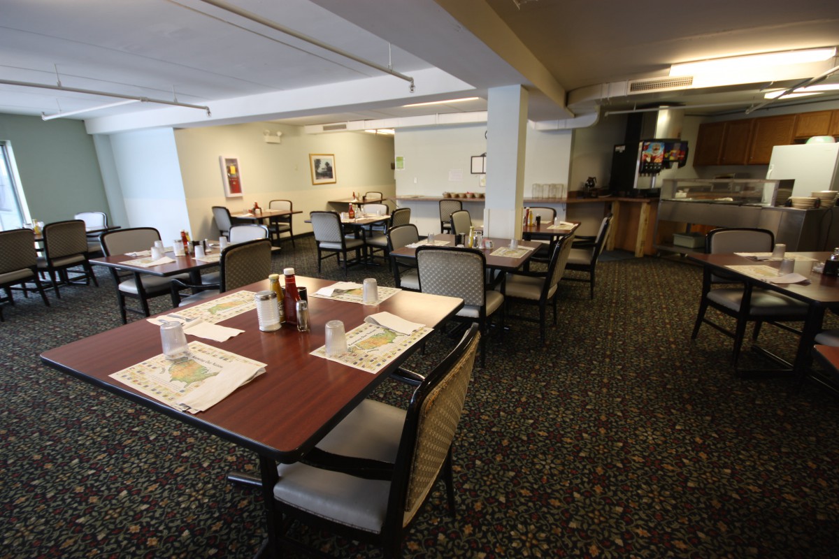 An indoor dining area with neatly arranged tables and chairs.