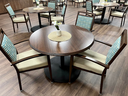 A stylish modern dining table set with four chairs, ideal for casual dining.