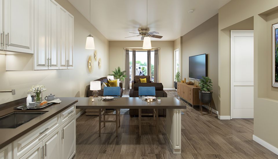 A modern living room with an open concept dining area, featuring sleek furniture, wood flooring, and natural light.