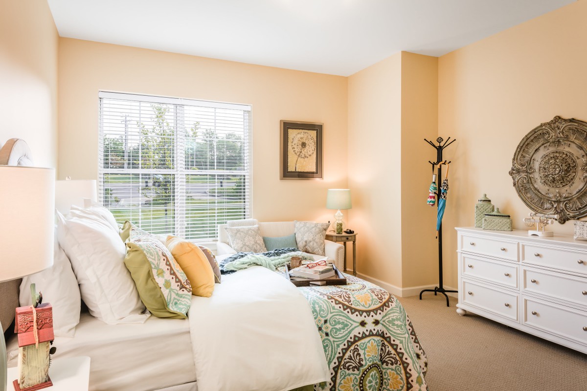 A cozy bedroom with stylish decor and soft lighting.