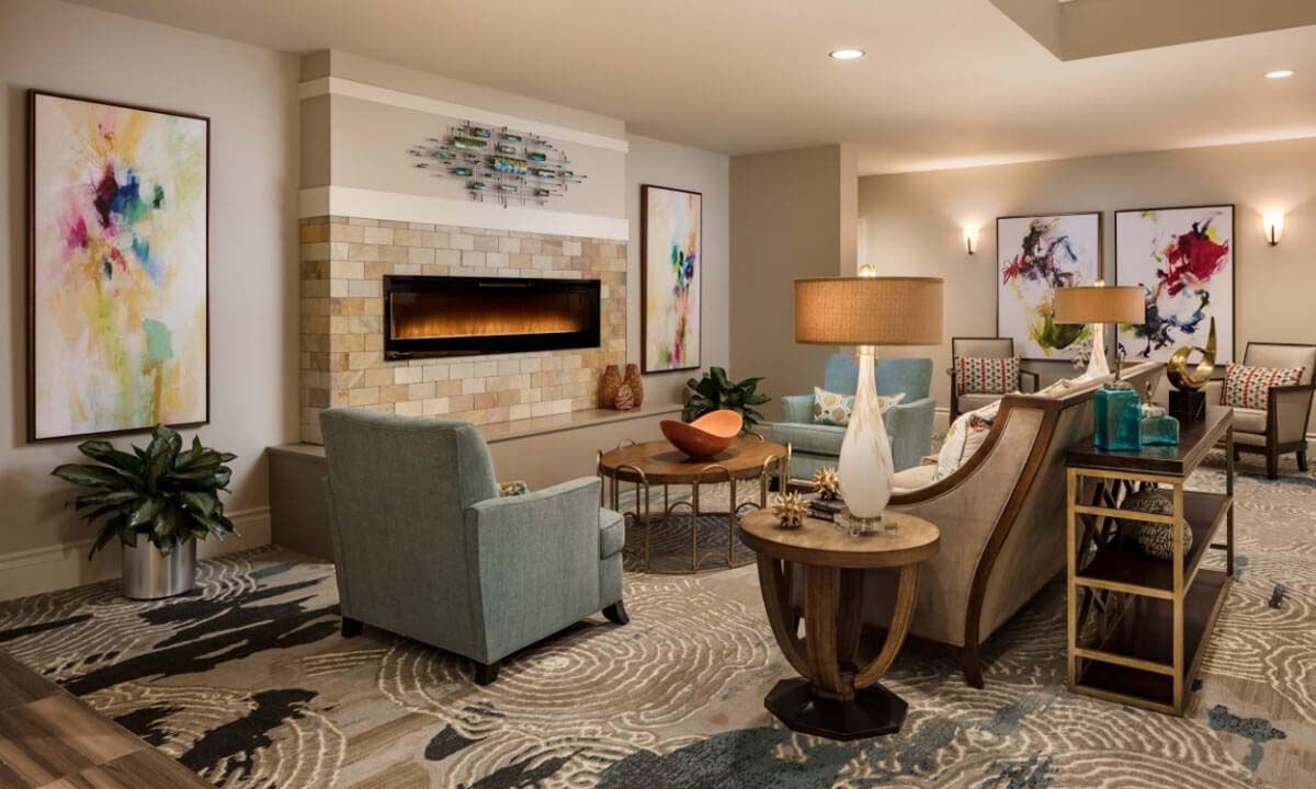 A modern living room with stylish furniture and a cozy fireplace.