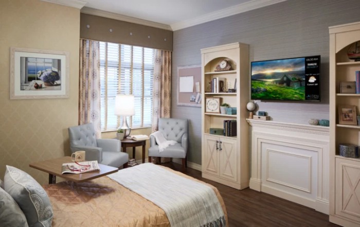 A cozy and modern bedroom interior with elegant furniture and natural lighting.