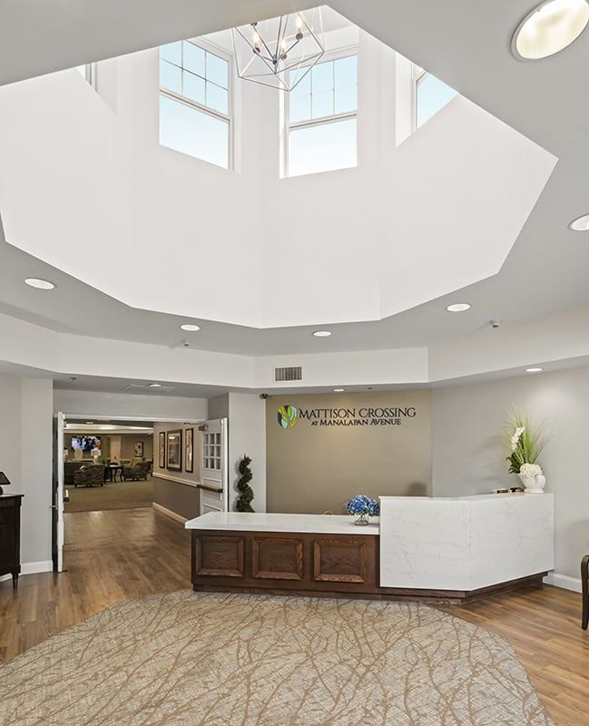 Modern reception area with a bright skylight and welcoming decor.