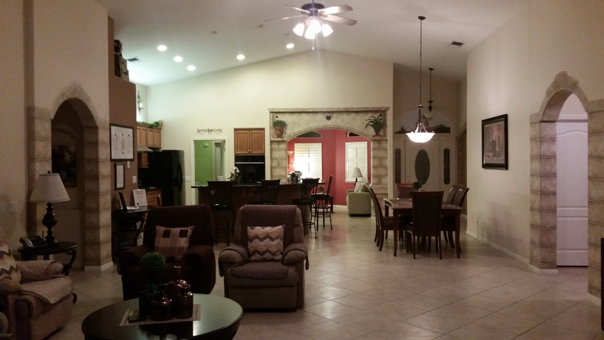 Spacious open floor plan with a cozy living room, dining area, and adjacent kitchen.