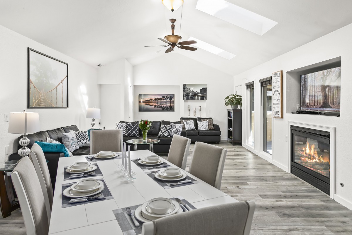 A contemporary open-concept living and dining area with modern furnishings and elegant decor.