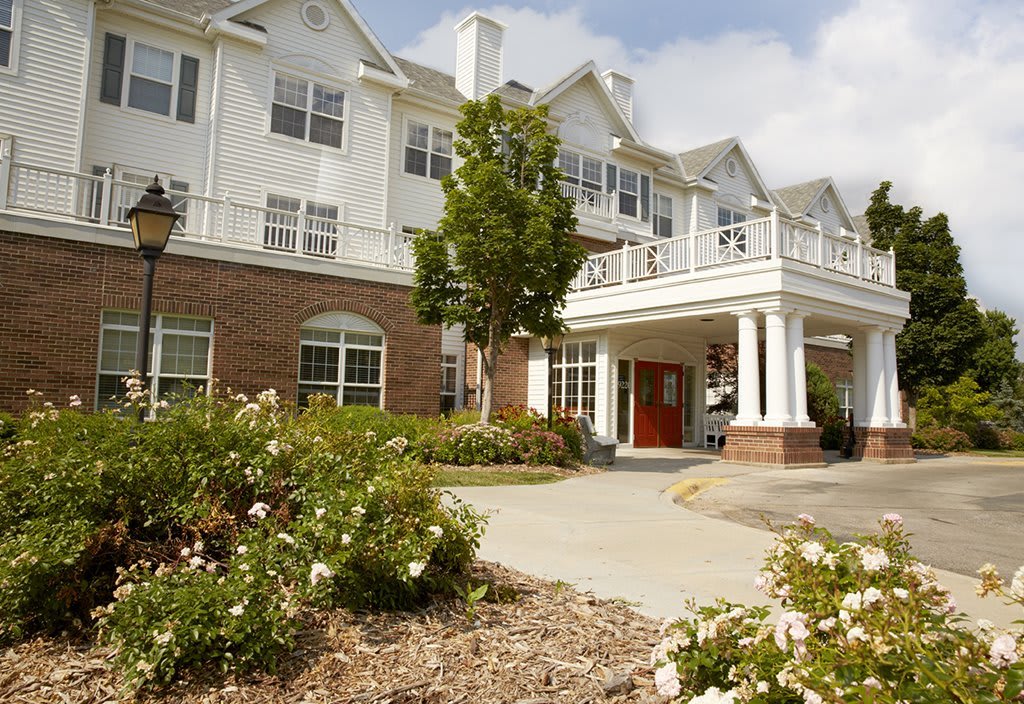 A well-maintained residential building with landscaped gardens and a welcoming entrance.