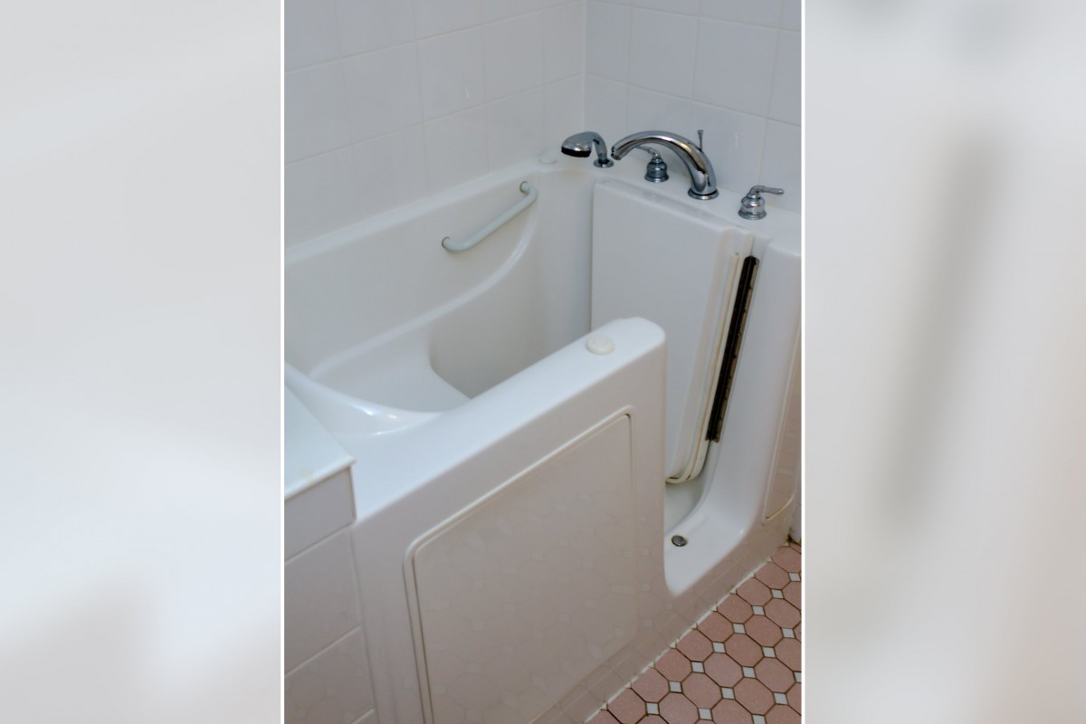 A walk-in bathtub with safety features designed for accessibility.