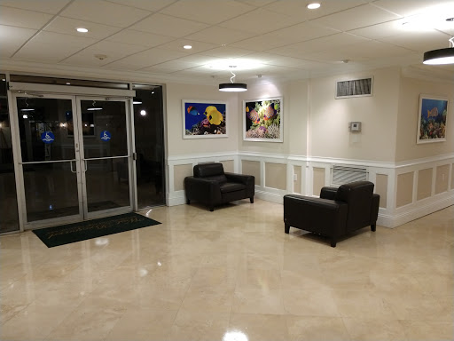 A modern lobby featuring comfortable seating and artistic decor.