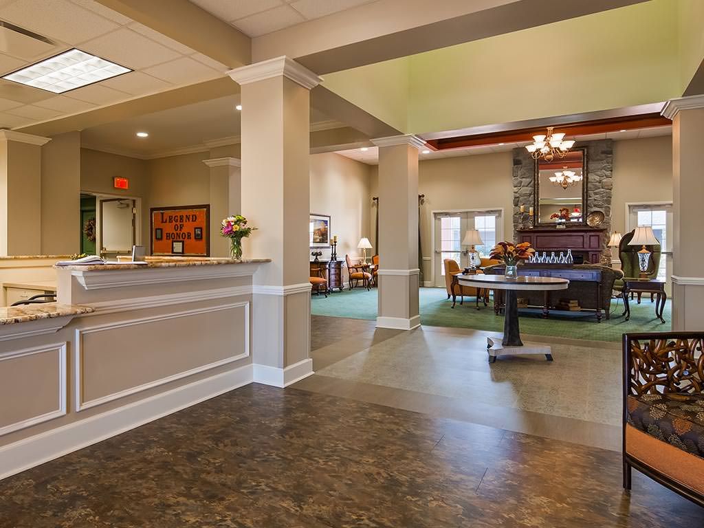 A welcoming hotel lobby with a reception desk and comfortable seating area.