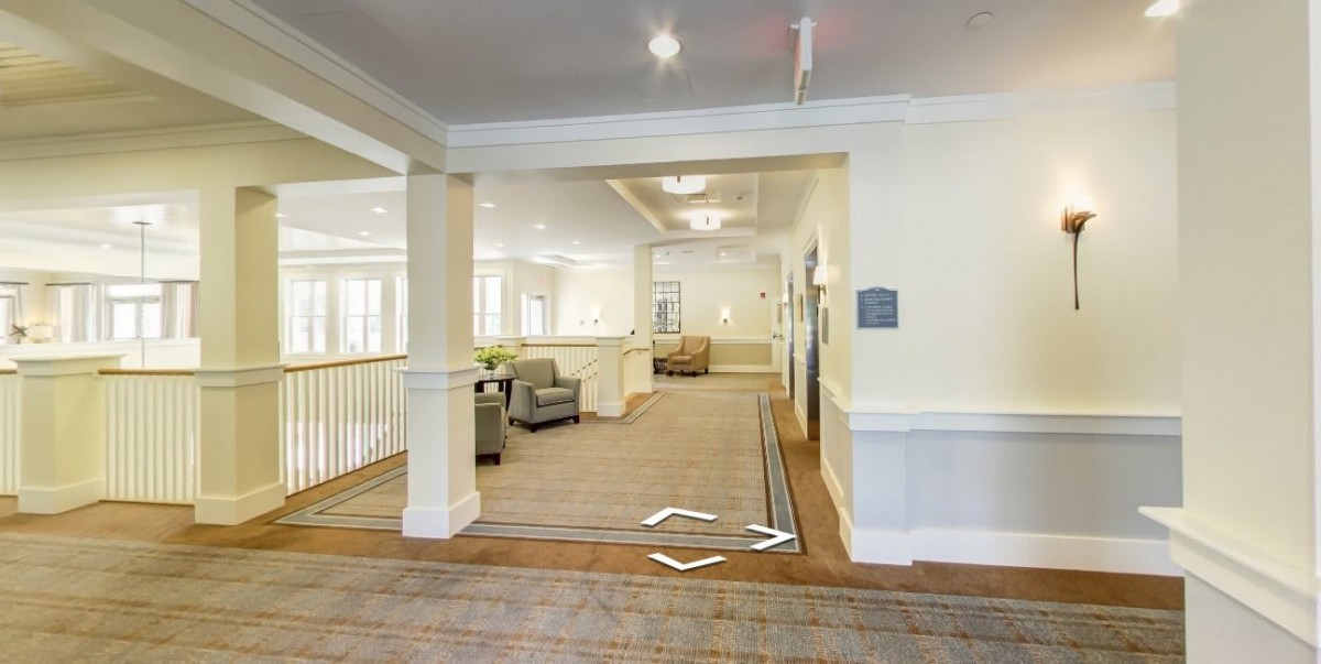 A spacious, well-lit lobby area with comfortable seating and elegant design.