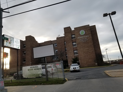 A view of a residential building on a cloudy day.