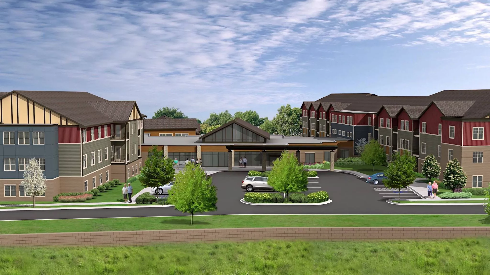 A suburban building complex with a parking lot and landscaped surroundings.