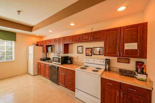 A well-equipped kitchen featuring wooden cabinets and modern appliances.