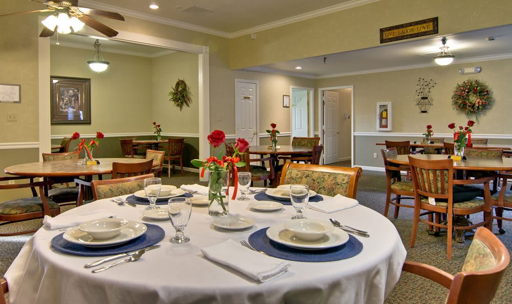 An elegantly set dining table in a cozy restaurant interior.