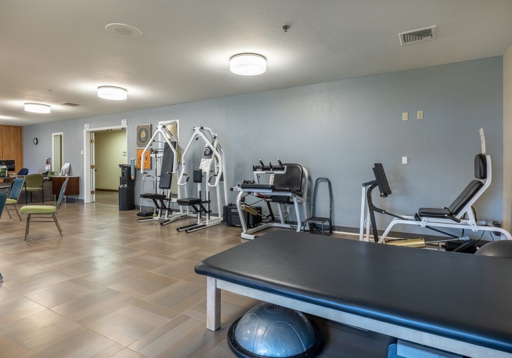 A well-equipped gym with a variety of fitness machines and exercise spaces.