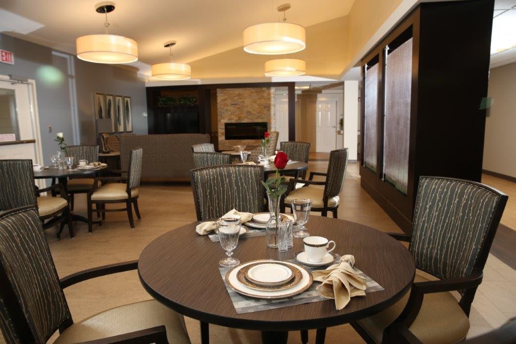 A modern dining room with elegantly set tables and comfortable seating.