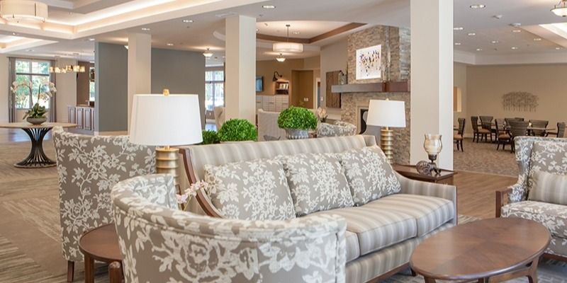 A stylish living room with a patterned sofa and elegant decor.