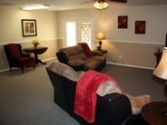 A cozy living room with a sofa and decorative elements.
