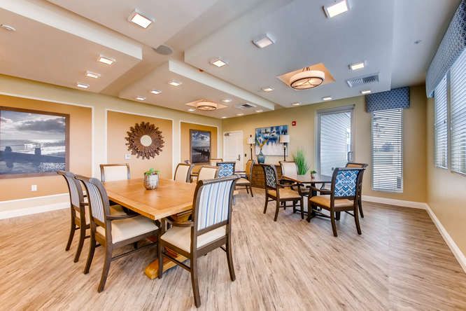A modern dining area with elegant furniture and bright lighting.