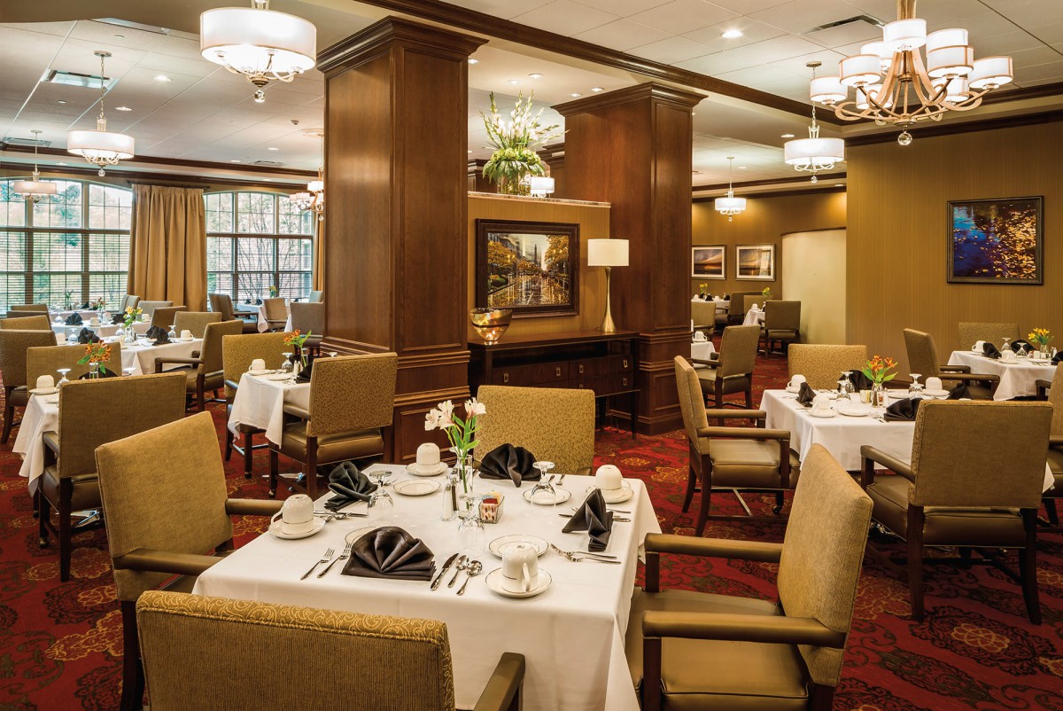 An elegant restaurant dining room with neatly arranged tables and sophisticated decor.