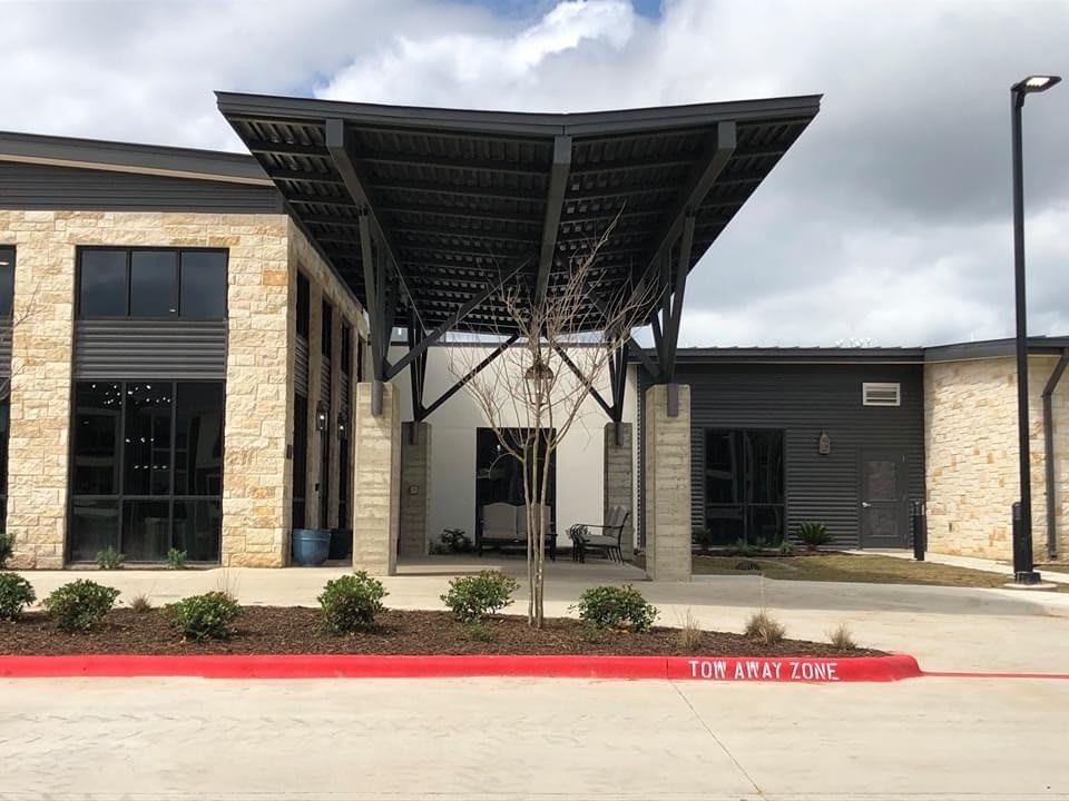 Modern building entrance with a distinctive awning.