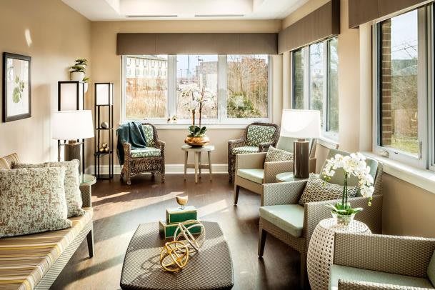 A bright and modern living room with ample seating and natural light.