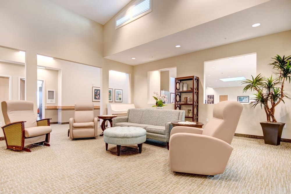 A bright and modern lounge area featuring comfortable seating and decor.